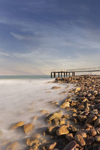 Long exposure shot of structure over beach