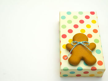 Directly above shot of stuffed toy on table against white background