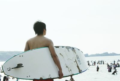 Woman in mountains against clear sky