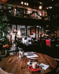 Table and chairs in restaurant at night