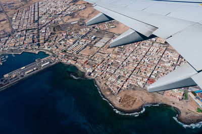 Aerial view through window of plane