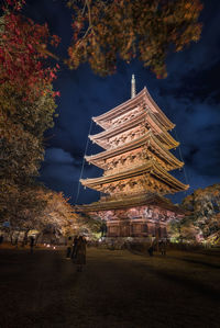 Illuminated building against sky at night