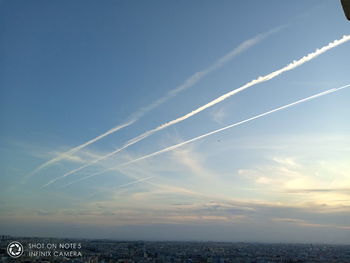 Scenic view of vapor trails in sky