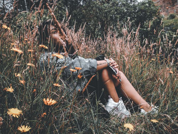 Woman relaxing on field