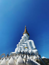 Low angle view of sculpture against sky