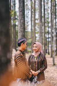 Couple kissing in the forest