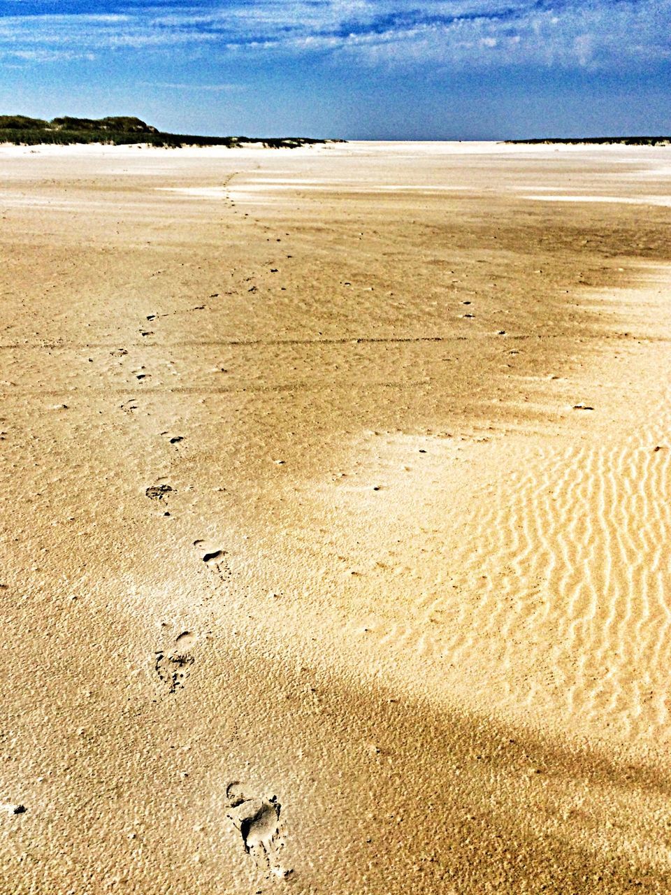 sand, beach, shore, sea, tranquility, tranquil scene, footprint, scenics, beauty in nature, nature, water, sky, horizon over water, coastline, blue, sandy, sand dune, day, idyllic, remote