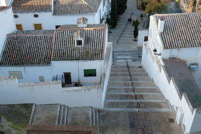 High angle view of steps amidst buildings in town