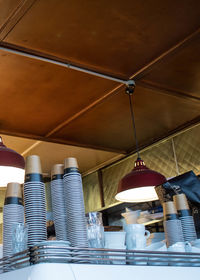 Low angle view of man hanging on ceiling