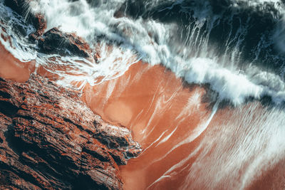 Blurred motion of rock formation in sea