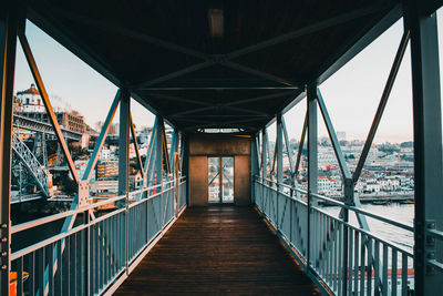 Footbridge over bridge against sky