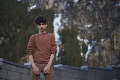 Portrait of man standing outdoors during winter