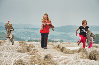 Full length of woman on beach against sky