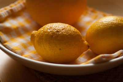 Close-up of lemons in plate