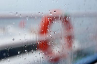 Full frame shot of wet glass window in rainy season