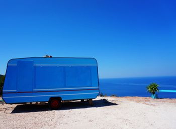View of sea against clear blue sky