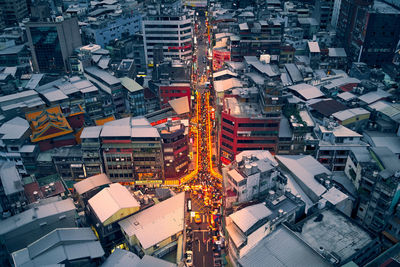 High angle view of illuminated buildings in city