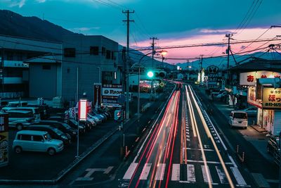 Railroad tracks against cloudy sky