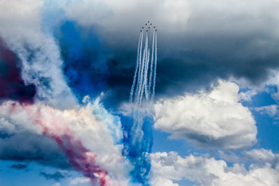 Low angle view of vapor trails in sky