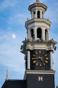 Low angle view of bell tower against sky