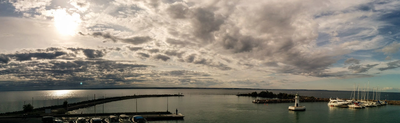 nautical vessel, water, transportation, mode of transport, sea, boat, sky, cloud - sky, moored, tranquil scene, waterfront, tranquility, scenics, nature, beauty in nature, cloud, outdoors, harbor, cloudy, no people