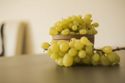 Close-up of grapes in plate on table