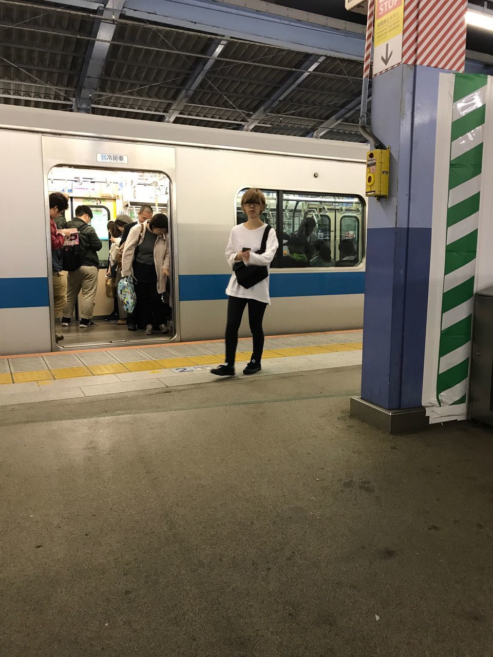 public transportation, real people, train - vehicle, transportation, railroad station platform, railroad station, lifestyles, women, full length, rail transportation, leisure activity, men, standing, day, one person, outdoors, adult, people