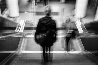 Rear view of woman in bus