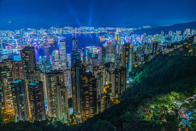 High angle view of illuminated buildings in city at night