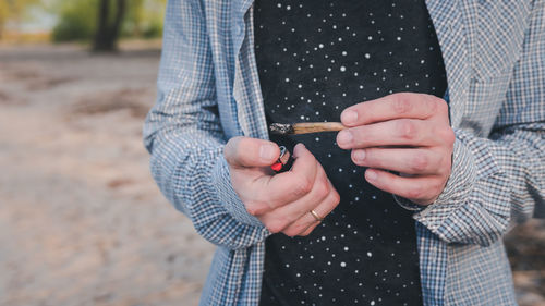 Midsection of woman holding hands