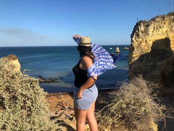 Woman looking at view of sea