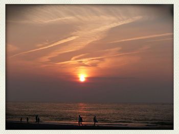 Scenic view of sea at sunset