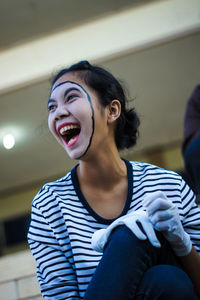 Portrait mime of young woman looking away 