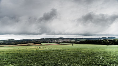 Scenic view of golf course against sky