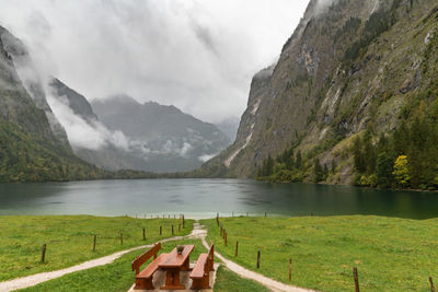 Scenic view of lake and mountains against sky