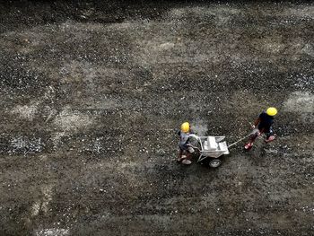 High angle view of people working on road