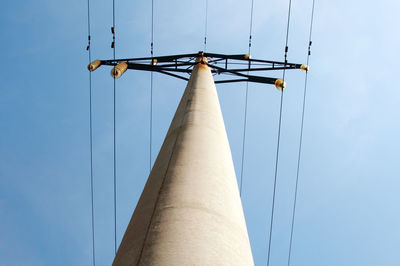 Low angle view of communications tower against sky