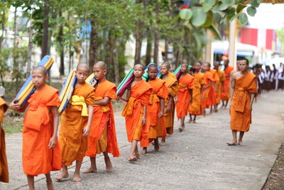 Group of people walking on street