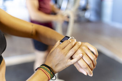 Woman checking time at health club