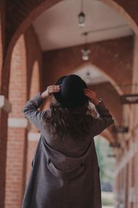 Rear view of woman photographing