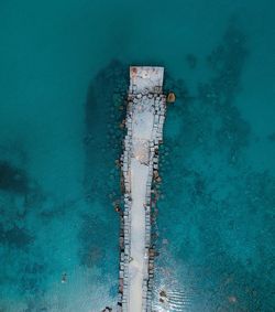 High angle view of sailboat sailing on swimming pool