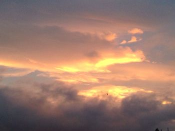 Low angle view of cloudy sky during sunset