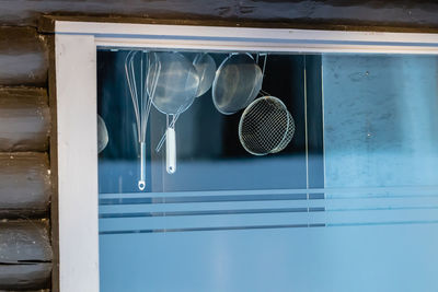 Kitchen utensil hanging at window 