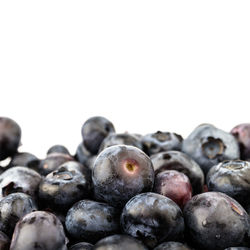 Close-up of blueberries against white background