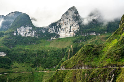 Scenic view of landscape and mountains against sky