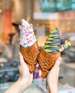 Midsection of person holding ice cream cone