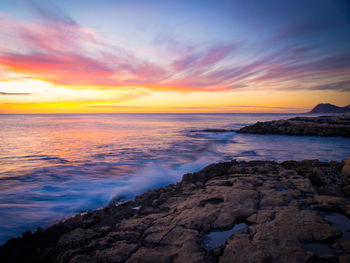 Scenic view of sea against sky during sunset