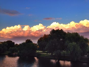 Scenic view of river at sunset