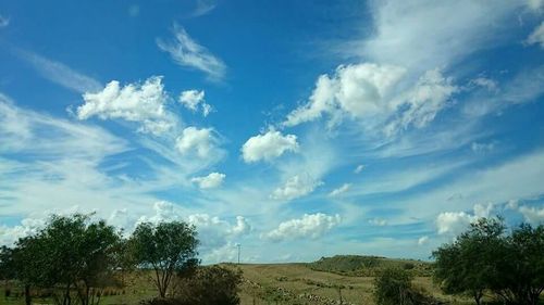 Scenic view of landscape against cloudy sky