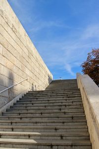 Low angle view of staircase against blue sky